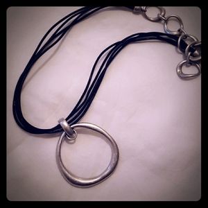 Silver toggle close leather band necklace.